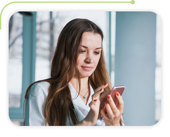 a picture of woman using Therap EVV module on her mobile phone