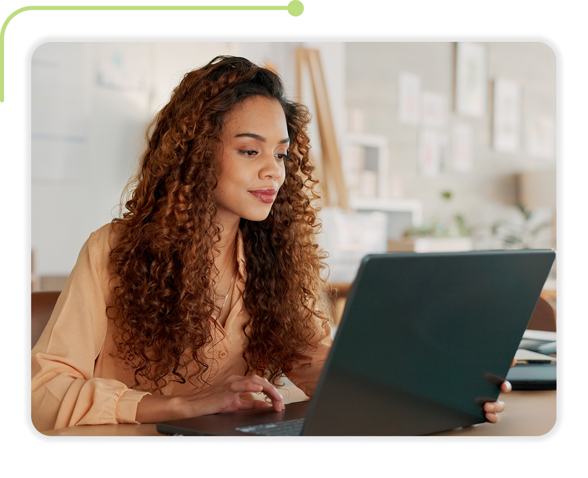A picture of a woman working with Therap application on a laptop