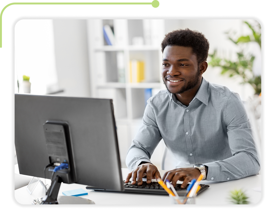 Picture of a man sitting and working on his laptop