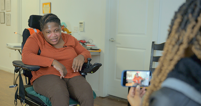Brittney Lee, a passionate self‑advocate who has received services at Richmond Residential for over 15 years, spoke during the panel about why visual introductions are so powerful:
